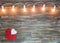 Valentine wooden textured background with light garland