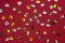 Valentines background with golden confetti hearts, red flat lay. Birthday, Mothers day, Valentines day greeting, glitters,