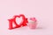 Valentines cupcake with a pink heart shaped cake pick on a pink background, Saint Valentine romance monochrome concept, sweet food