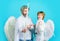 Valentines day angels. Little son and father with white wings. Father with little son in angel costume.