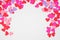 Valentines Day arched border with paper heart confetti over a white background