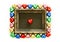 Valentines Day background with colorful chocolates heart shape and gold frame from top view.