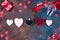 Valentines day background with handmaded hearts, glasses, cookies and gift box on a stone background. Valentine`s Day