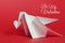 Valentines day background. Origami dove carrying paper heart wit