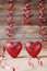 Valentines day background. Pair of glitter hearts on vintage wooden table. Greeting card.