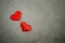 Valentines day background with red hearts on old concrete table.