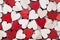 Valentines day background with white end red hearts on wooden background