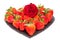 Valentines day breakfast. Heart shaped platter of strawberries with red rose