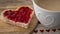Valentines Day Breakfast, heart shaped toast with strawberry jam and coffee