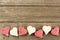 Valentines Day candy border on wood background