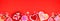 Valentines Day candy bottom border on a red banner background