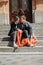 Valentines day celebration and dating concept. Happy loving couple with red Love Balloons in the city street. Outdoor