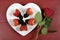 Valentines Day chocolate dipped heart shaped strawberries with rose