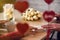 Valentines day.  Close-up of woman and man celebrating in restaurant. Boyfriend giving small box gift to girlfriend. View through