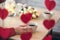 Valentines day.  Close-up of woman and man celebrating in restaurant. Boyfriend giving small box gift to girlfriend. View through