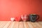 Valentines day concept with chalkboard coffee mugs and heart shapes on wooden table