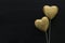 Valentines day concept. gold glitter hearts over black background. Flat lay composition