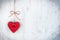 Valentines day concept. Heart shaped cookie tied with hemp bow over white wood rustic background.