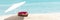 Valentines day concept. Two hearts - symbol of love couple on sand beach under parasol. Traveling together. Wide banner