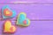 Valentines day decor. Beautiful felt heart decor on a wooden background with copy space for text. Valentines day symbols