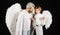Valentines day. Father and son in angel wings. Little cupid boy and bearded man in white clothes.