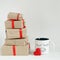 Valentines day gift boxes, toy heart and coffee cup with cutest funny eyes on white background, cute holiday breakfast concept
