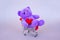Valentines Day gift. Lilac Teddy Bear, bright plush toy with red heart in supermarket trolley.  Retro romantic style