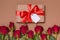 Valentines day gift ribbon bow tag, seamless nude background red roses, free copy text space