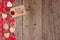 Valentines Day gift tag and heart side border on wood