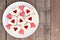 Valentines Day heart cookies with jam and candies over wood