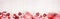 Valentines Day long banner border with red gifts and decorations over a white wood background with copy space