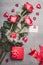 Valentines day, love or dating concept. Red roses bunch with gift box, blank paper greeting card, ribbon and hearts , top view