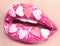 Valentines Day makeup. Lips with pink hearts sugar sprinkles. Valentine hearts sweet makeup