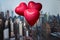 Valentines day in the New York city. Three red balloons in form of heart flying over Manhattan and skyscrapers. Ð¡oncept.