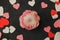 Valentines day newborn background - flower bed with white, pink, red hearts on burgundy backdrop