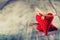 Valentines day. Red cloth handmade hearts on wooden background