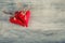 Valentines day. Red cloth handmade hearts on wooden background