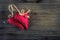 Valentines day. Red cloth handmade hearts on wooden background