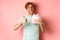 Valentines day and romance concept. Cheerful young man holding box with gift and showing thumbs-up, thanking for present