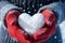 Valentines Day sentiment hands in mittens shaping a snowy heart