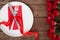 Valentines day table setting with plate, fork, knife, ring, ribbon and roses. background