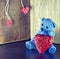 Valentines Day. Teddy Bear Loving cute with red hearts sitting alone. Vintage.