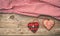 Valentines day. Top view of fabric hearts, wooden background