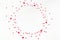 Valentines day or wedding festive composition. Circle made of red and pink paper heart shaped confetti isolated on white