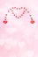 Valentines day or wedding vertical festive pink background with hearts bokeh. Two small hearts merging to one big heart