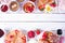 Valentines or Mothers Day breakfast double border on a white wood background with heart shaped pancakes, eggs and love themed food