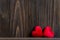 Valentineâ€™s Day. Sewed pillow red hearts clothespins on the old wood planks, vintage tone. Happy lovers day card mock up