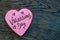 Valentineâ€™s Day wrote text on pink love heart with drawn hearts. On rustic wooden background. Love Valentines concept