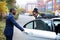 Valet Opening Door For Businesswoman Getting Out Of A Car