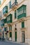 Valetta- Malta. Traditional ornate balconies painted in green